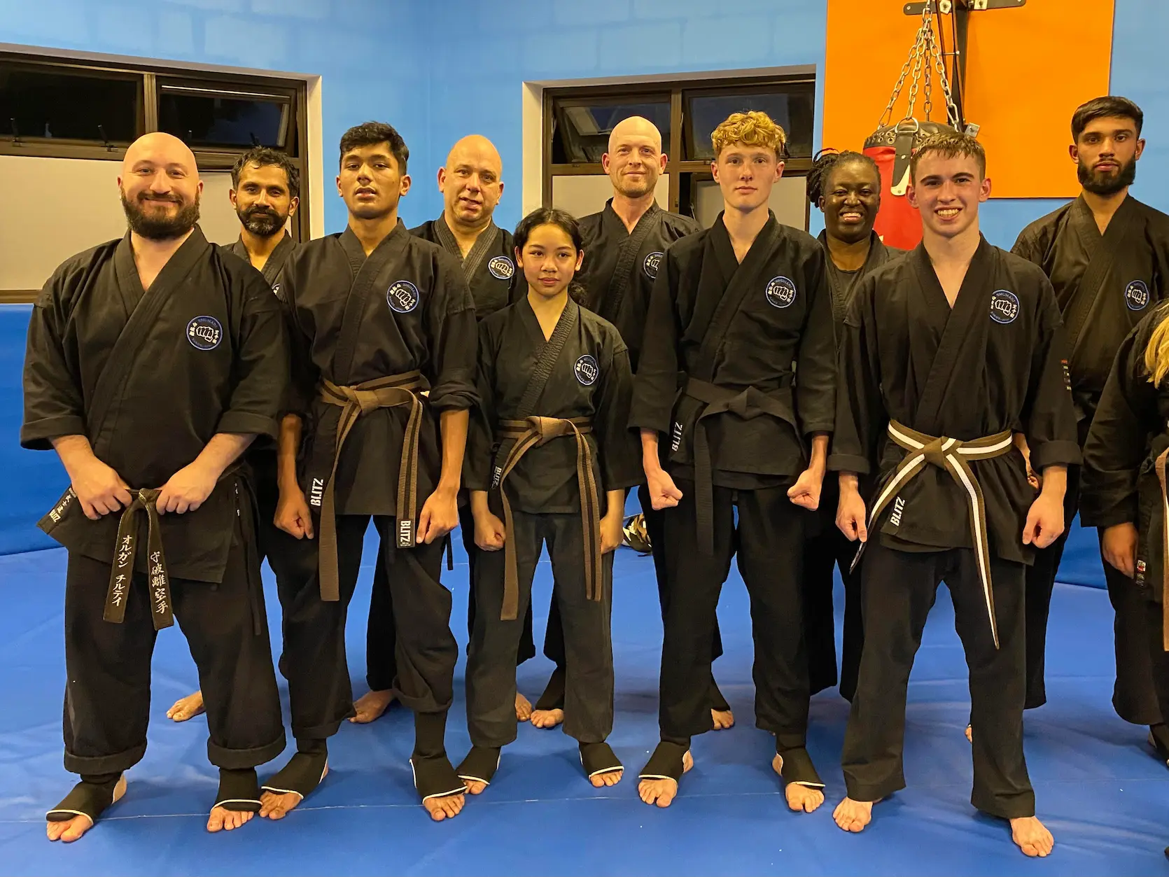 Family martial arts class with children and adults learning together at Shuhari Self Defence Slough