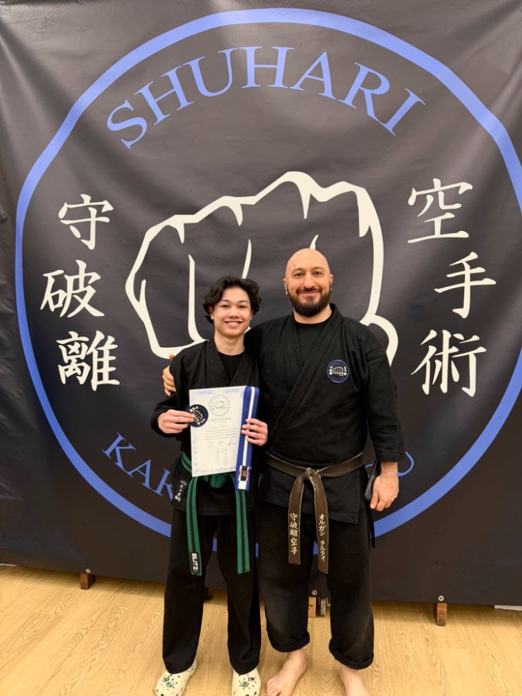Martial arts student earning a new belt at Shuhari Self Defence in Maidenhead