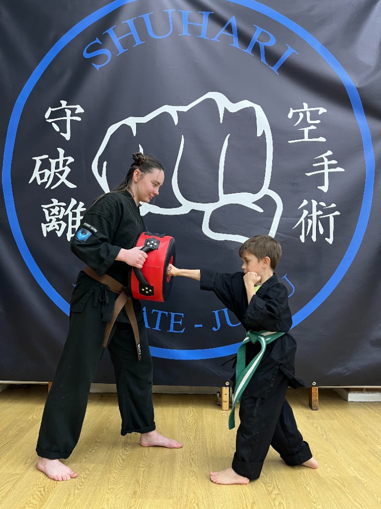 Students practising karate techniques at Shuhari Self Defence in Slough