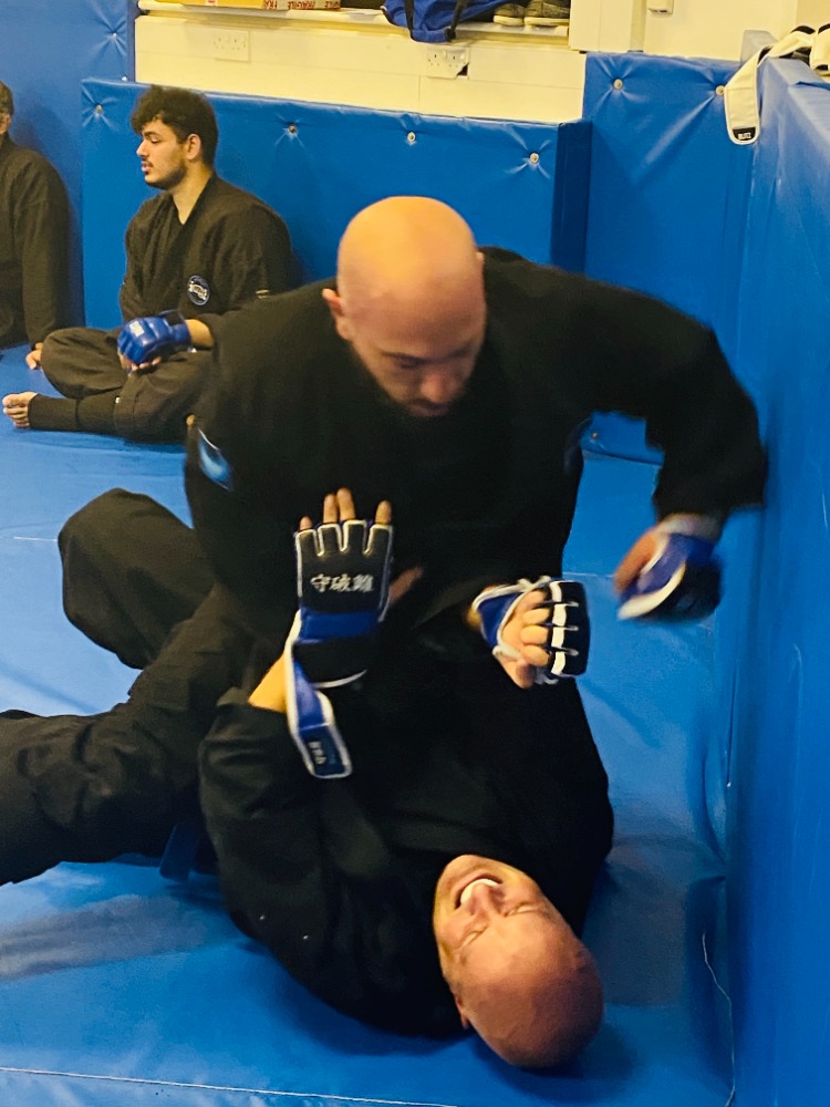 Olgun Tiltay demonstrating pragmatic martial arts training with a partner