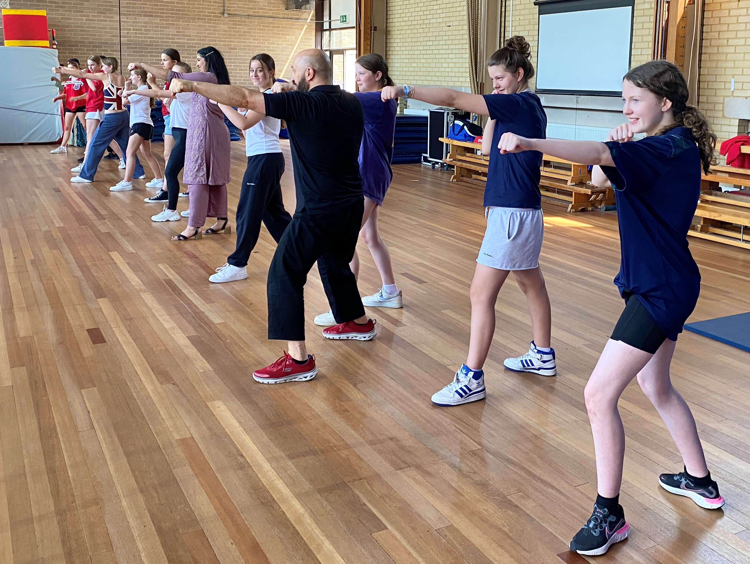 Children practising martial arts technique in an after-school class at Shuhari Self Defence Maidenhead
