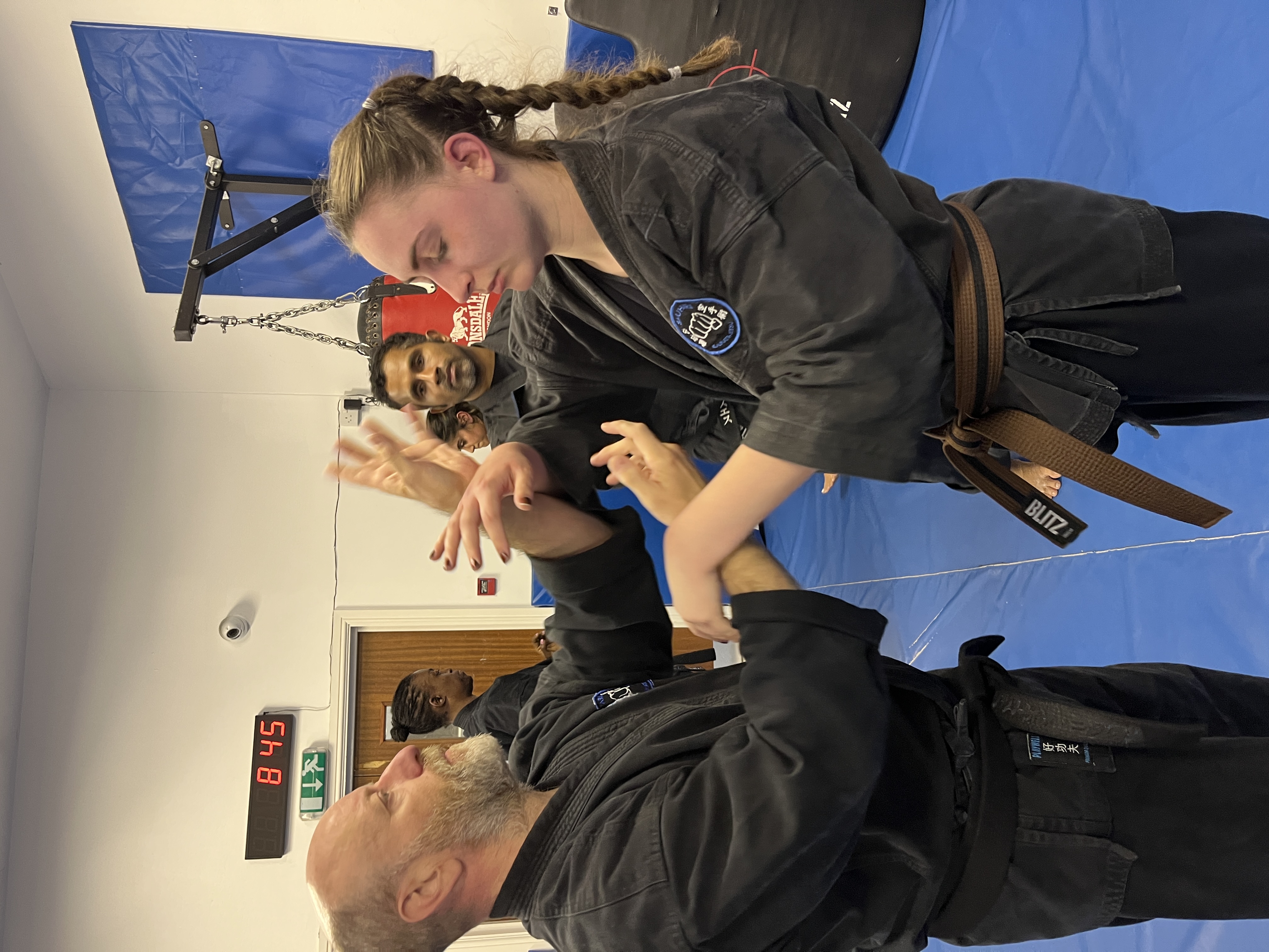 Brian Southon of Shuhari Self Defence Cippenhampracticing chi sao sticky hands drills in a martial arts class