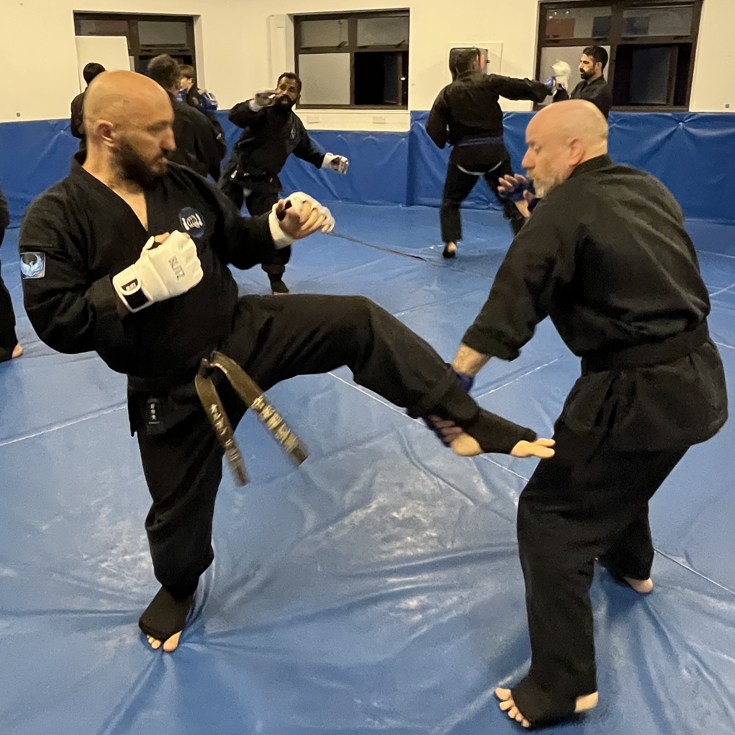 Brian Southon of Shuhari Self Defence Cippenham practicing kumite with his instructor Olgun Tiltay Brian Southon of Shuhari Self Defence Cippenham practicing kumite with his instructor Olgun Tiltay