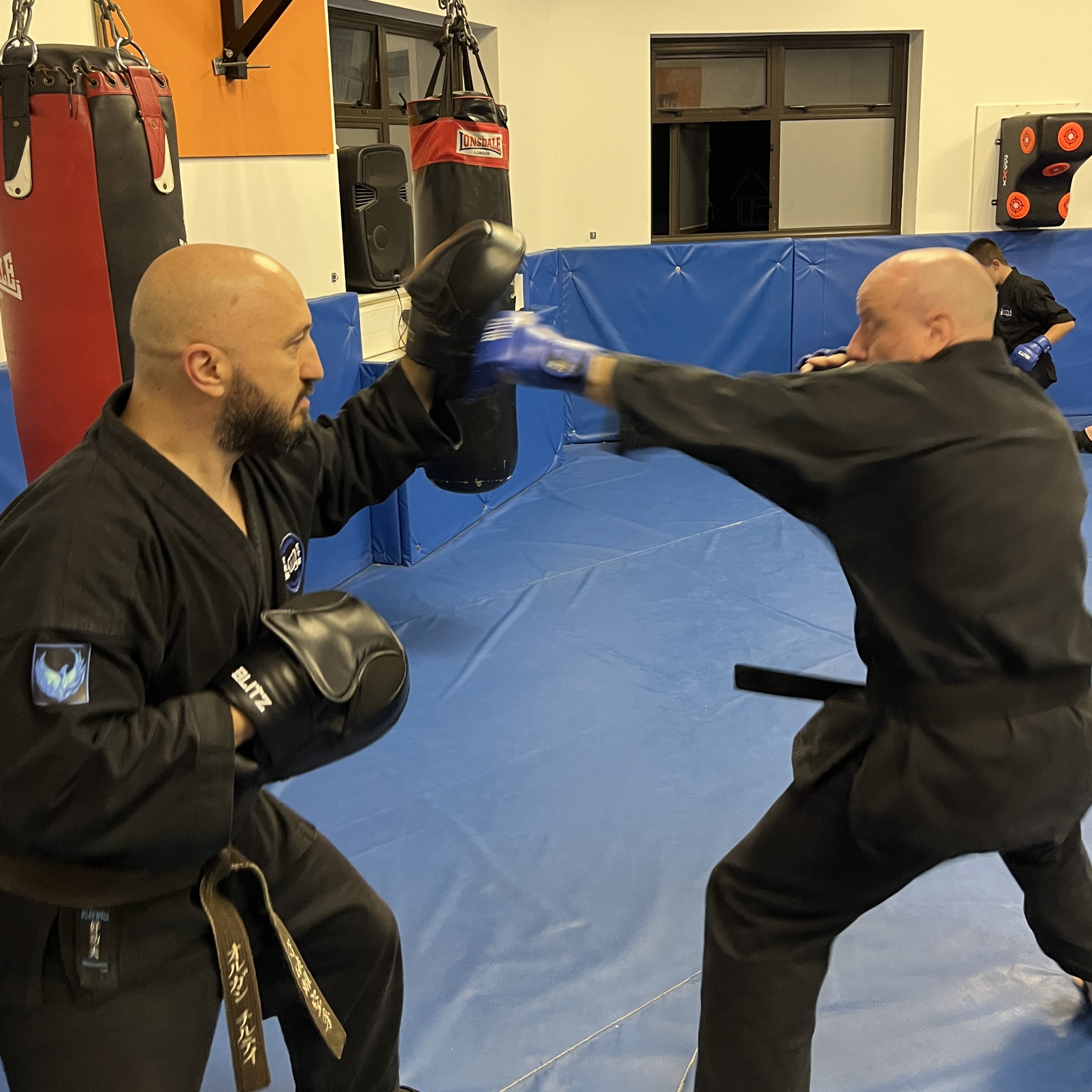Brian Southon of Shuhari Self Defence Cippenham practicing striking basics with his instructor Olgun Tiltay