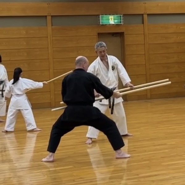 Brian Southon of Shuhari Self Defence Cippenham learning Bo [long staff] in Nagoya Japan from Hideki Yamada Sensei