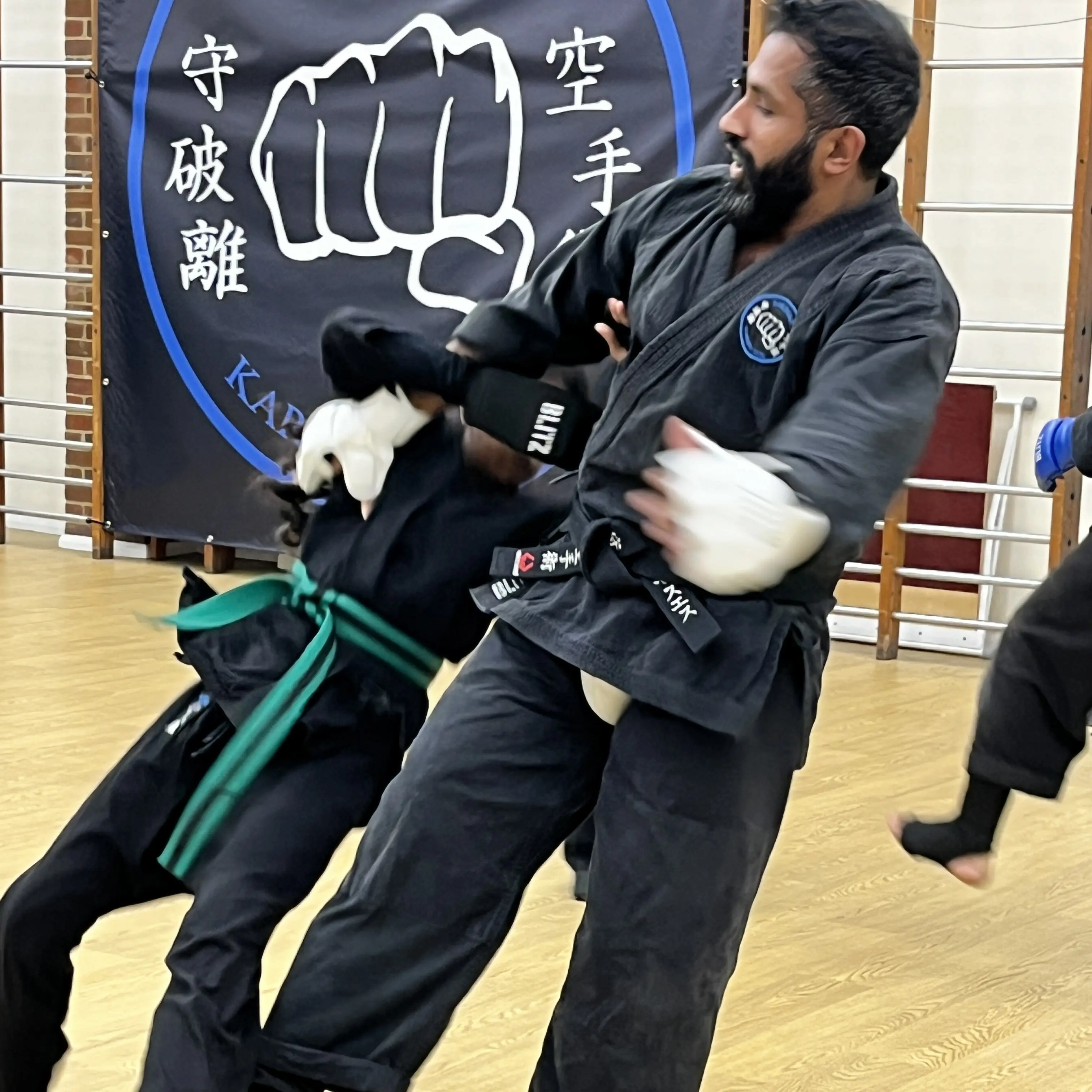 John Moses of Shuhari Self Defence Bracknell assessing a student in a martial arts grading