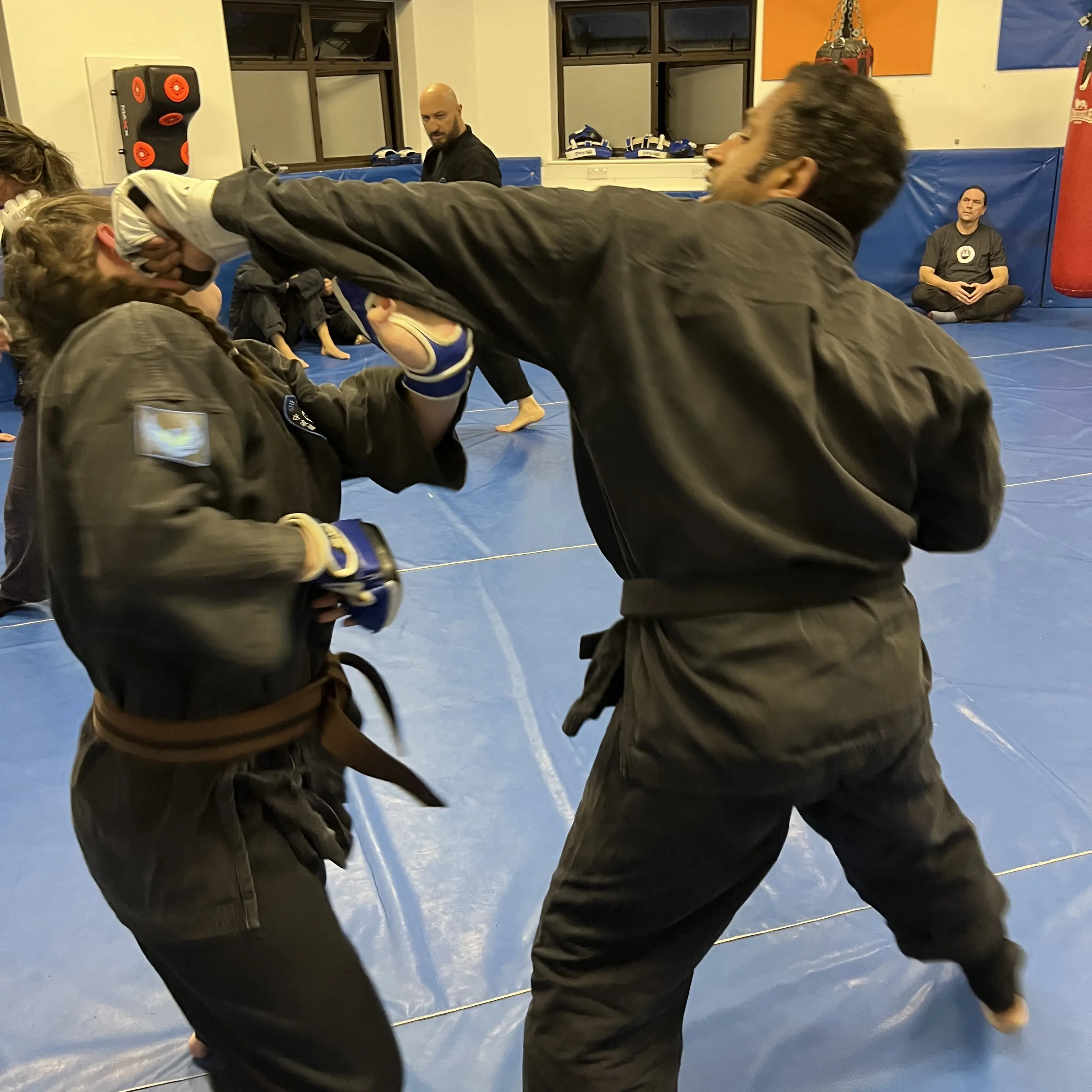 John Moses of Shuhari Self Defence Bracknell doing contact sparring in an MMA class