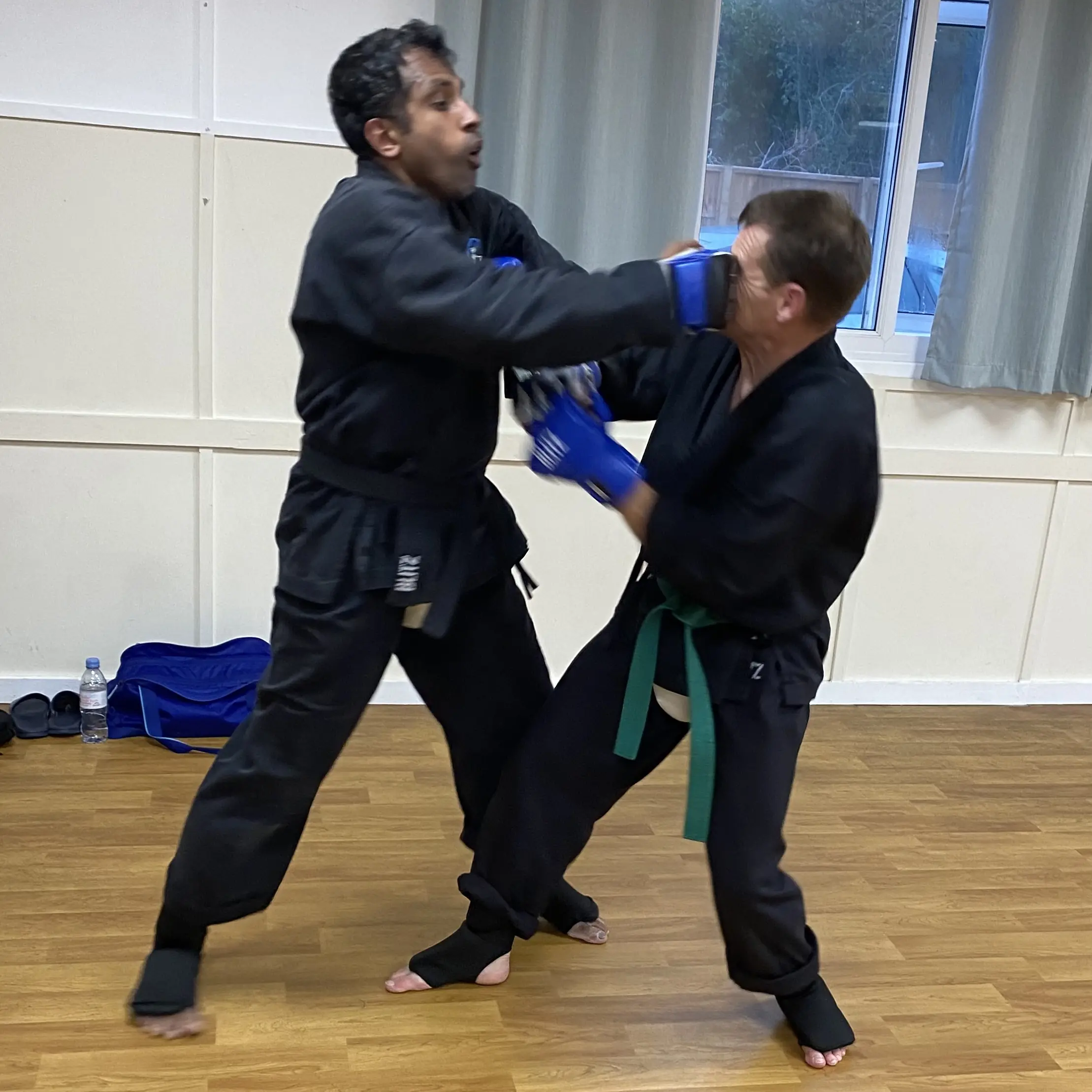 John Moses of Shuhari Self Defence Bracknell practicing full contact sparring in an MMA class