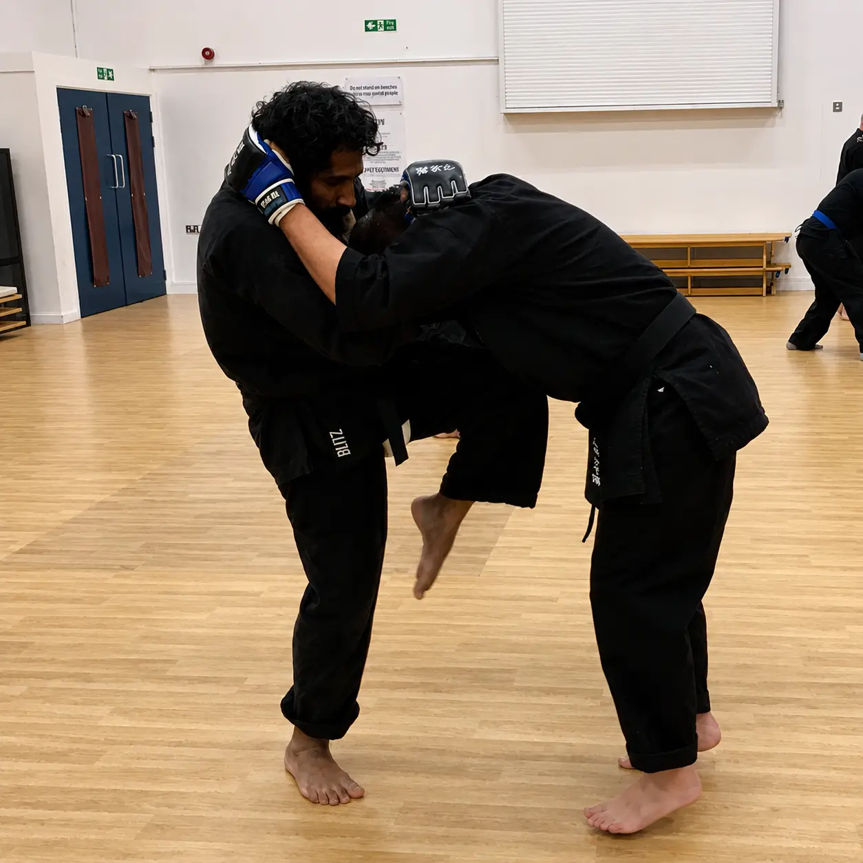 John Moses of Shuhari Self Defence Bracknell practicing knee strikes in a karate class