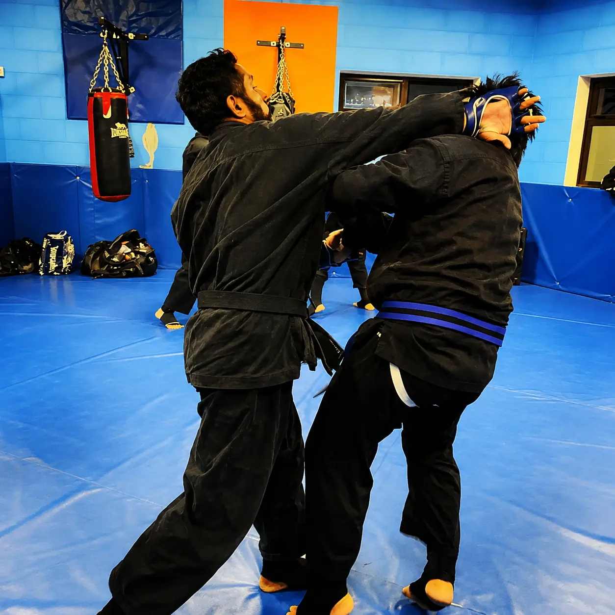 John Moses of Shuhari Self Defence Bracknell sparring with a student in an MMA class