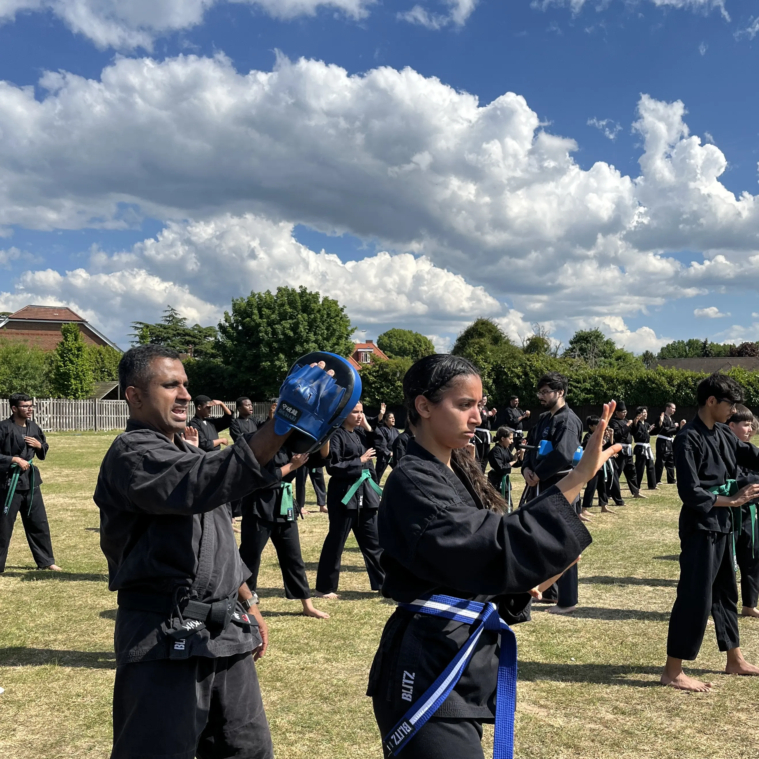 John Moses of Shuhari Self Defence Bracknell teaching pad work in a karate class