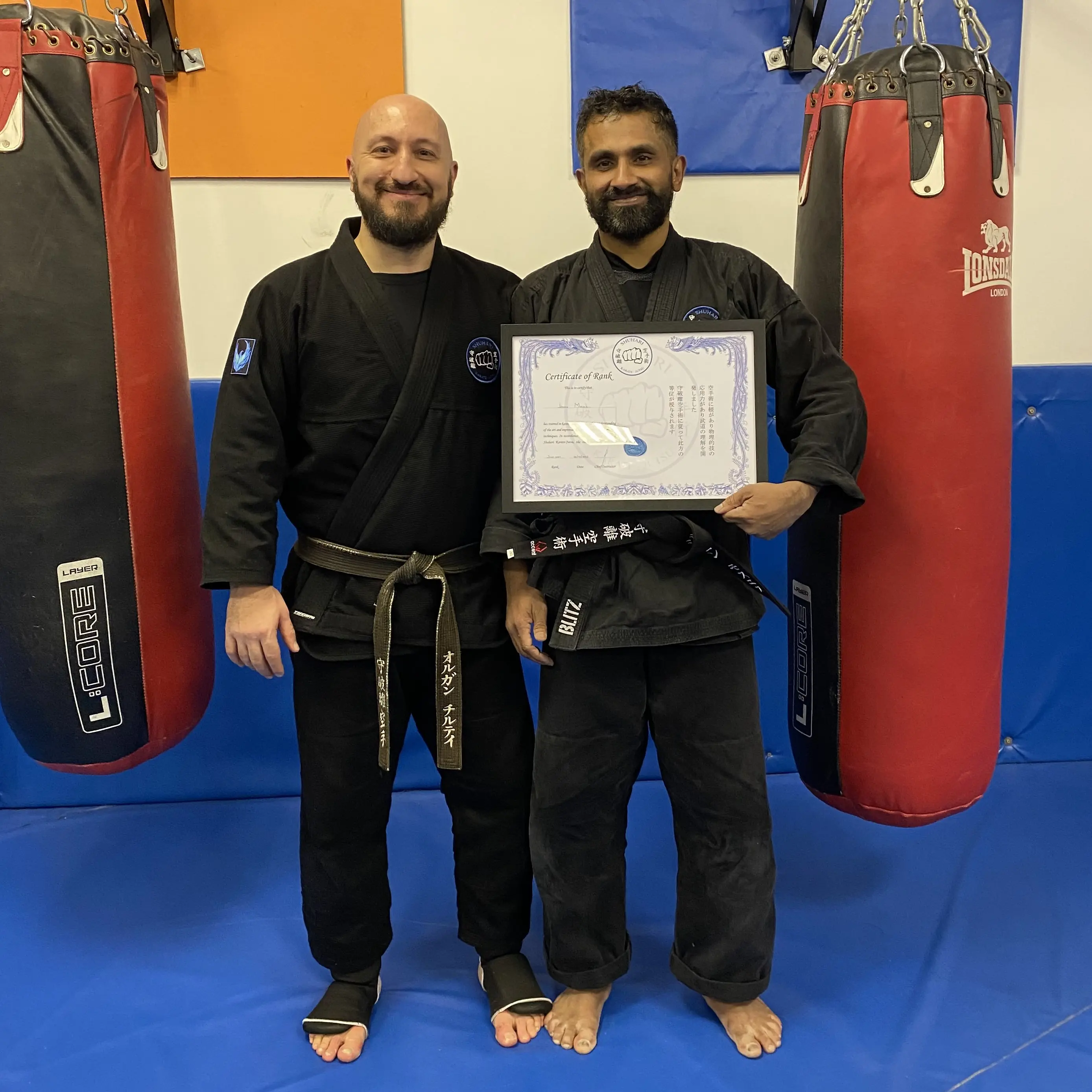 John Moses of Shuhari Self Defence Bracknell graded to his second dan black belt in karate by his instructor Olgun Tiltay
