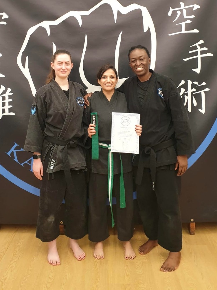Sensei Vee and Sensei Nadine Peters, our 2 female martial arts instructors at Shuhari Self Defence Langley celebrating their students grading