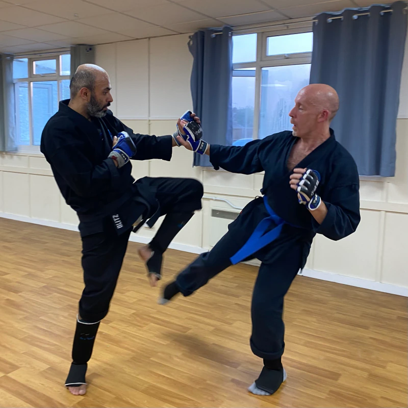 Majid Khalid of Shuhari Self Defence Slough sparring in a martial arts class in Cippenham with Andy Jones