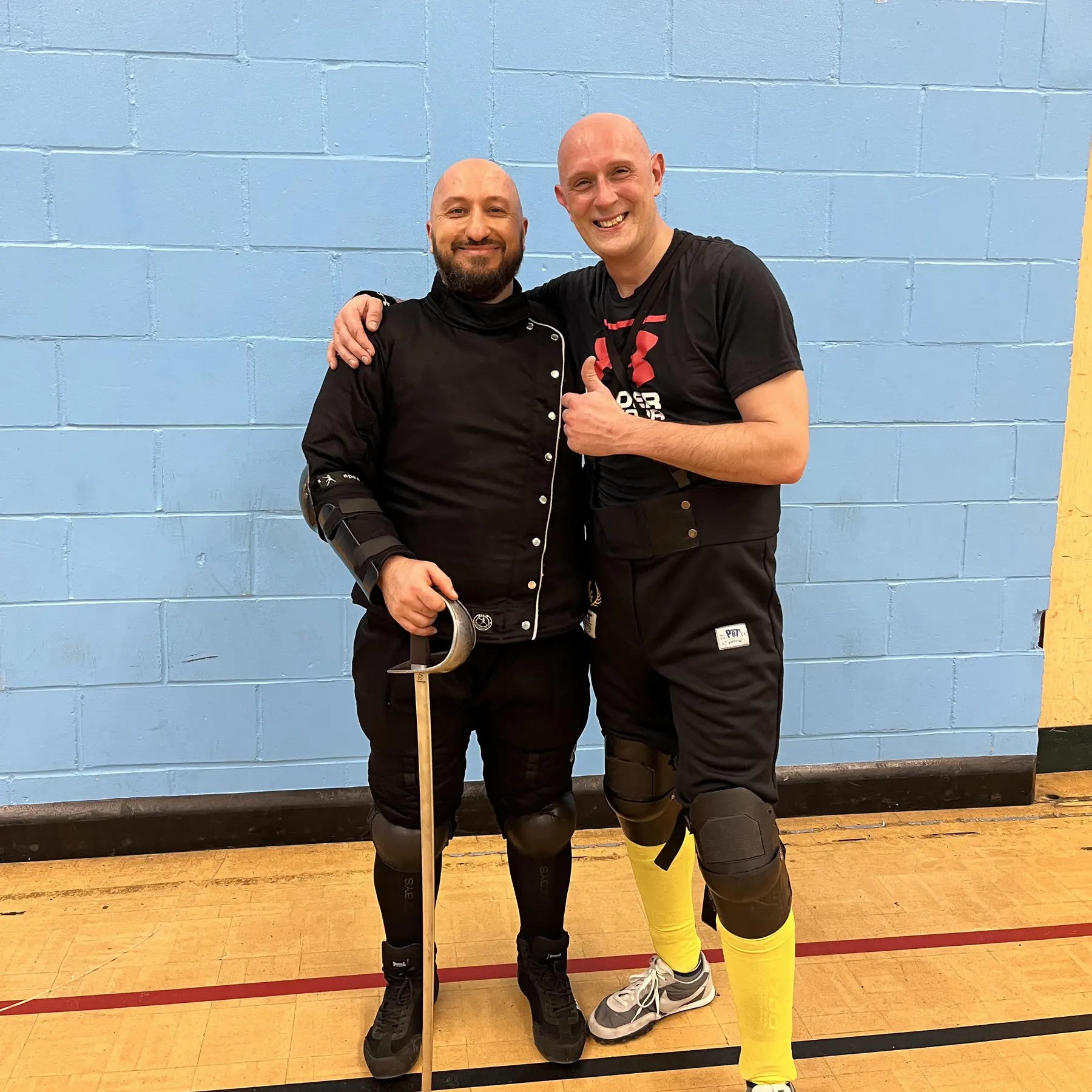Olgun learning military sabre from Matt Easton HEMA instructor - Schola Gladiatoria